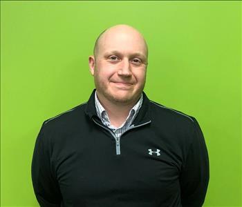 Employee Matt Kirsch Infront of Green Background
